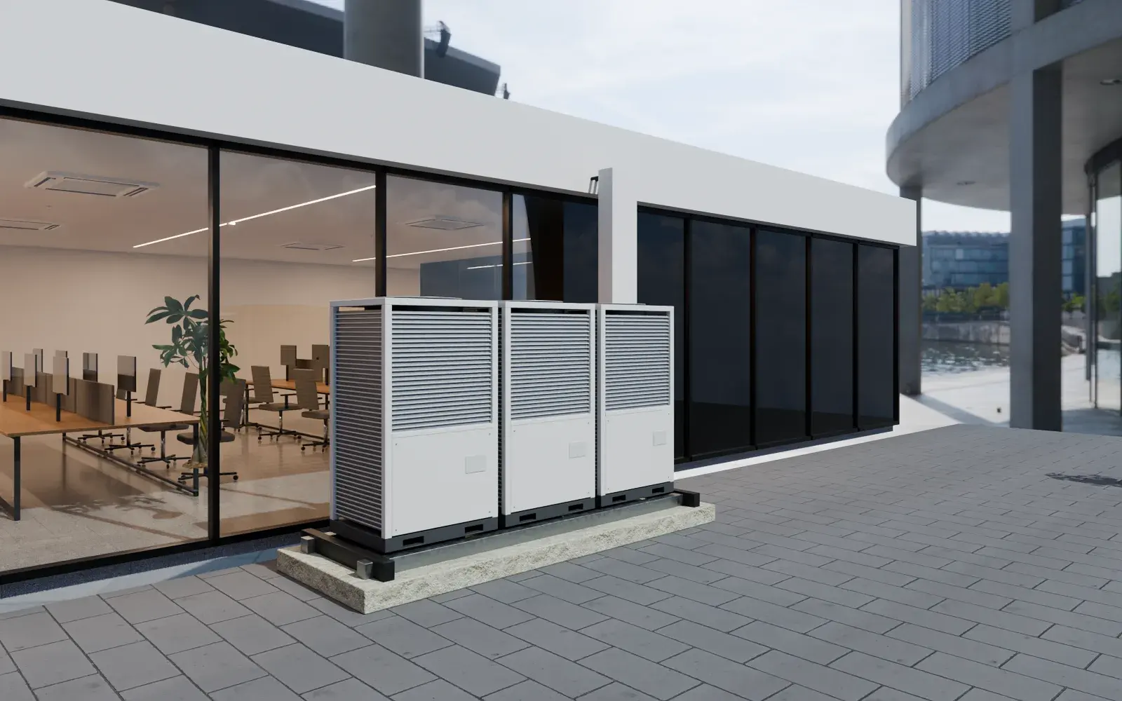 Illustrative example: VRV outdoor units on an office terrace, piped into the building, with the multi-zone office behind the glazing.